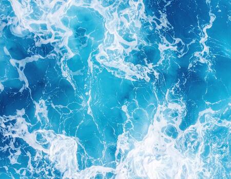 Vibrant ocean surface showcases mesmerizing blend of shimmering blue and white waves, creating captivating and dynamic scene that evokes sense of tranquility and wonder photo