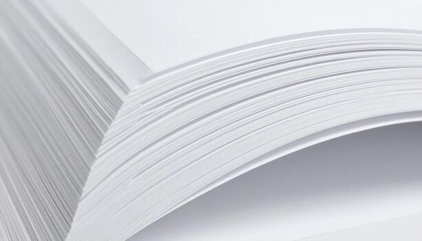 A stack of white paper on a table photo