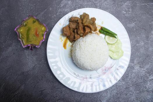 Beef Curry and Rice Set Menu with Salad and Soup in plate top view of Asian food photo