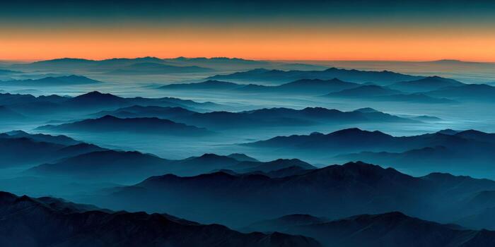 The sun is setting over the mountains in this photo