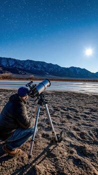 A man is looking through a telescope at the moon photo