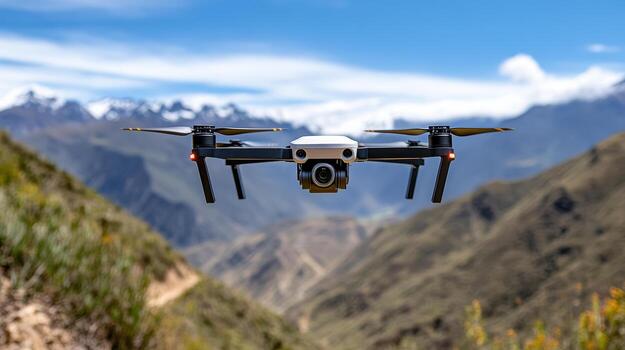 Drone flying over mountainous landscape, capturing stunning views of nature and remote areas photo