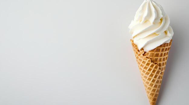 Creamy ice cream swirl in waffle cone on light background evokes delightful treat photo