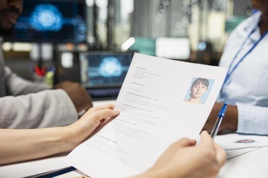 Close up of HR team using artificial intelligence systems to filter resumes, smart automation helping to evaluate applicants and streamline the onboarding process after interviews. photo