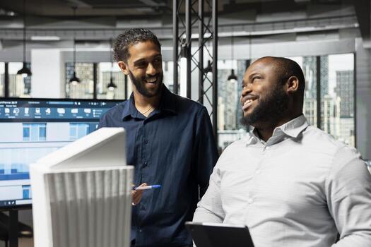 Real estate developers presenting strategic project using 3D models and architectural tools, emphasizing teamwork for urban development and infrastructure expansion through housing. photo