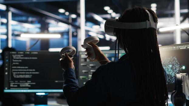 Data center technician using virtual reality tech and node tree software to analyze datasets. Server room expert using visual programming tools and VR equipment to improve gear performance, camera B photo