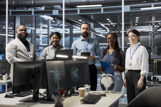 Portrait of smiling engineering team working in server farm, analyzing data. Happy teamworking employees examining infrastructure in data center, ensuring system integrity and security photo