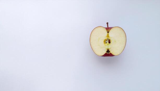 Red apple with half flat lay on white background with copy space, perfect for healthy eating themes, fruit photography, food packaging, nutrition concepts, and fresh produce design projects. photo