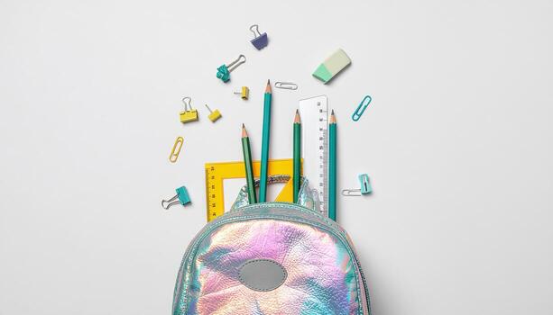 Back to school frame of school supplies flat lay on white background featuring pencils, notebooks, rulers, and other essentials, ideal for educational themes, stationery branding, classroom projects photo