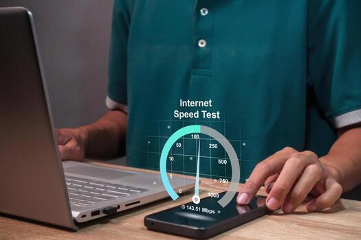 A man working on laptop and checking the internet speed. Internet network connection speed test concept. photo