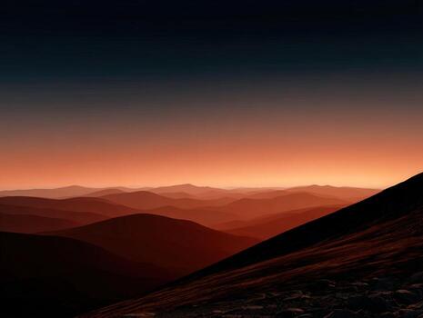 Sunset over mountains in a serene landscape photo