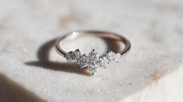 Elegant Diamond Ring On Marble Surface. Symbol Of Luxury And Commitment photo