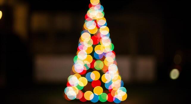 Out of focus colorful Christmas tree lights create a festive bokeh effect against a dark background photo