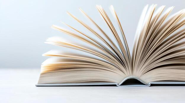 Open book with pages fanned out, showcasing texture and detail of paper photo