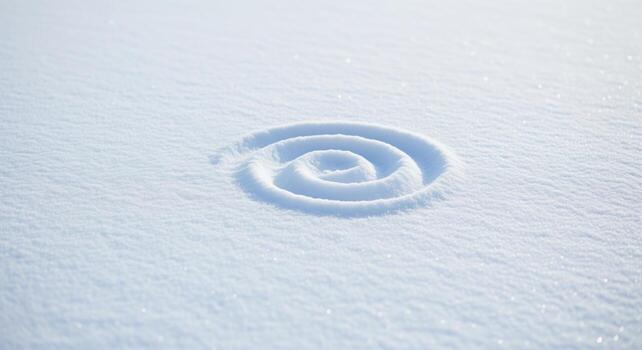 Spiral shape drawn in pristine white snow on a sunny winter day photo