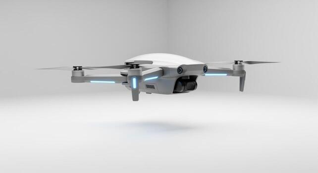 Sleek silver and white miniature delivery drone hovering in a clean studio environment photo