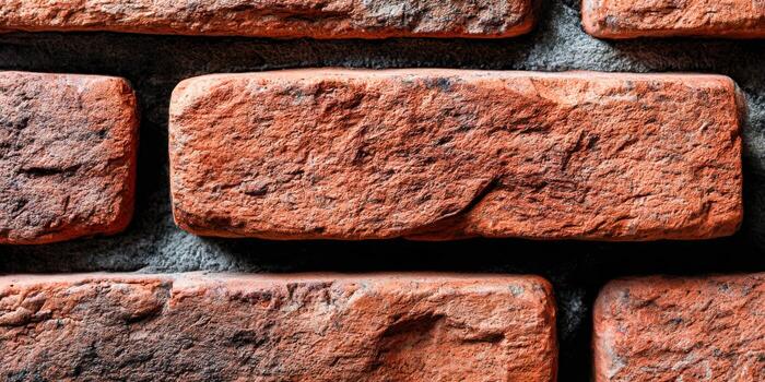 Intricate texture of rustic red bricks on wall photo