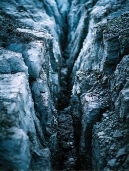 A hole in the ground with rocks and dirt photo