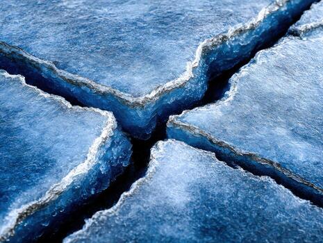 Ice cracks form in a frozen lake landscape photo