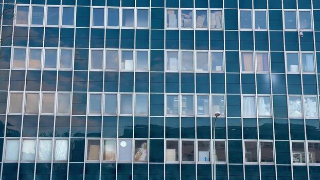 A building with many windows and a sky in the background photo