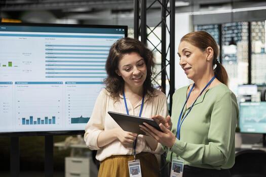 Empowered business associates planning a project with development goals, meeting in a boardroom to review data insights and performance indicators for multinational company growth. photo