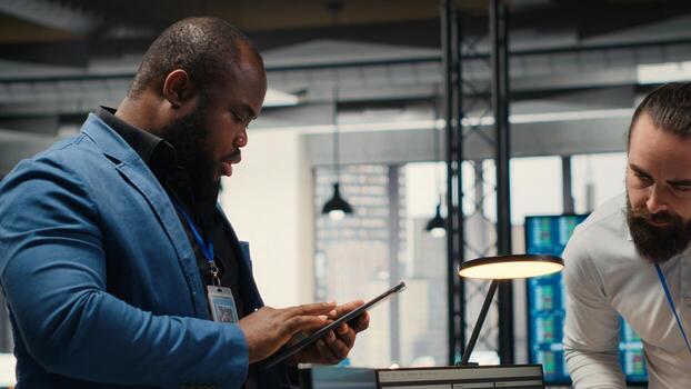 Professional colleagues team analyzing online graphs and resource allocation, demonstrating engagement and synergy between coworkers as they prepare performance reports. Networking. Camera B. photo