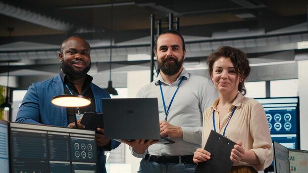 Team of office workers collaborating on project planning and briefing, using data from charts on tablet to drive performance metrics. Fostering teamwork and a workplace partnership. photo