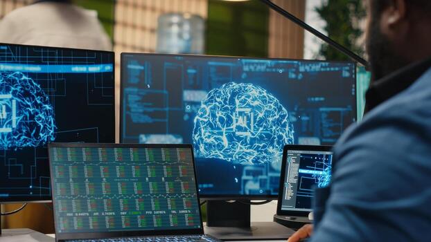 Black man IT expert handles neural networks systems for data forecasting, combining AI automation tools with digitalization to drive multinational company efficiency and innovation. Camera B. photo