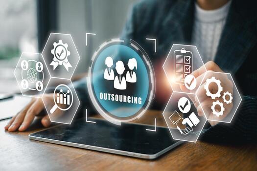 Visual representation of outsourcing with digital icons and business elements on a tablet in a contemporary office setting. photo