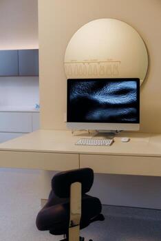 A Modern Workspace Featuring a Computer with an Abstract Art Background for Inspiration photo