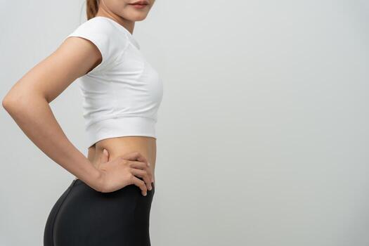 Woman showing results of diet. Beautiful shape. female show shape body have a reduced waist size after under going a weight loss corse. balance, control, routines, exercise. photo