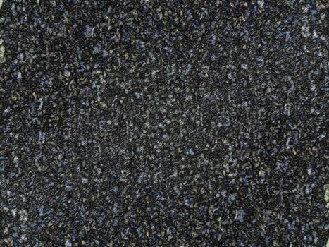 multicolor texturizado alfombra superficie con irregular abigarrado modelo y denso fibra tejido foto