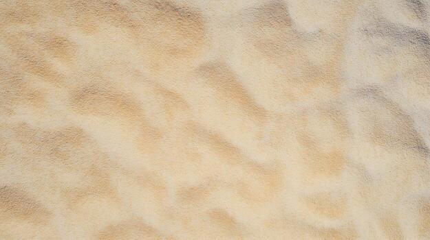 Overhead view of fine sand with smooth ripples and soft shadows texture background photo