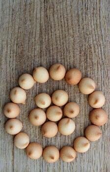 Homemade Mini Milk Cookies Laid Out In A Round Pattern On A Bakery Board Vertical Stock Photo