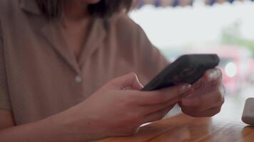 Close up view captures the intimacy of modern connection a person hands skillfully navigating a sleek smartphone screenengaging with digital information. video