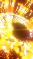 Spiral of glowing golden particles creating a dazzling luminous vortex against a dark background video