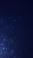 Blue glowing particles spread across a dark cosmic background, creating a starry and dreamy night effect video