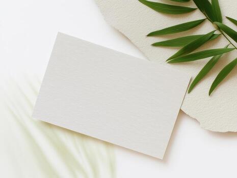Elegant boho card mockup design for invitations set on textured surface with greenery photo