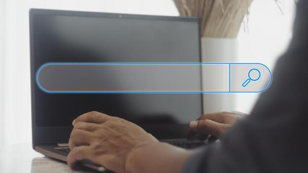 Man's hands are use a loptop to searching for information. Search Engine Optimization concept. photo