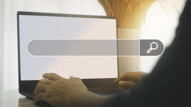 Man's hand are using a loptop to searching for information. Search Engine Optimization concept. photo