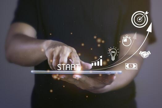 Startup concept with icon business and network connection on modern virtual interface from tablet. Man touching on tablet. photo