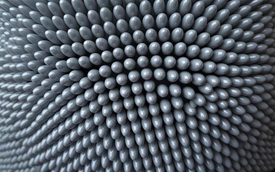 Close-up of a textured surface made of numerous interlocking gray spheres, creating a mesmerizing pattern. photo