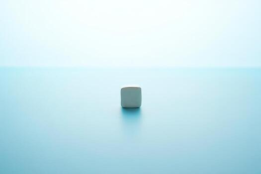 Minimalist white object centered on a soft blue gradient background photo