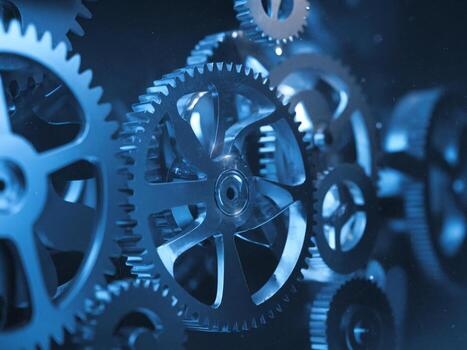 Close-up view of metallic gears in a blue tone, creating a dynamic and intricate mechanical pattern. photo