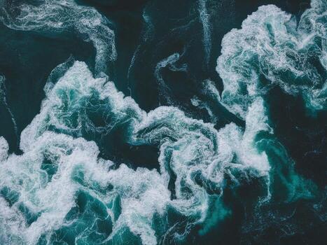 aéreo ver de vibrante Oceano olas creando dinámica patrones y texturas en profundo azul aguas foto