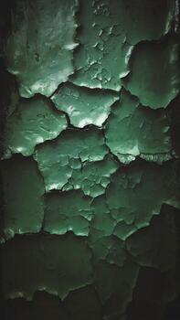 Textured green surface with cracked layers creating a striking visual effect. photo