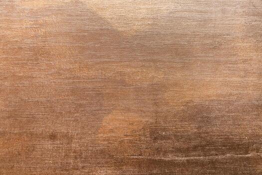 Textured brown surface with abstract patterns and gradients in natural lighting photo
