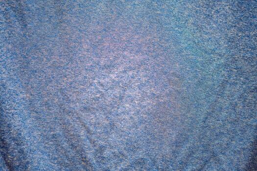 Textured blue fabric with subtle color variations and intricate patterns photo