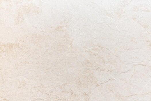 Light beige textured surface with subtle patterns for backgrounds or surfaces photo
