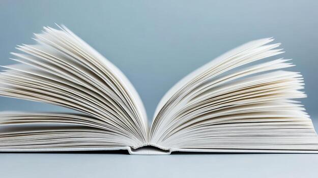 An open book with white pages on a blue background photo